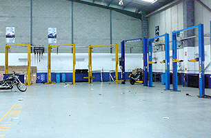 2 Post hoists in workshop for motor cycles