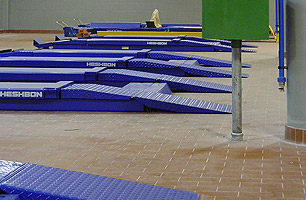 Scissor lifts installed in multi service bay workshop