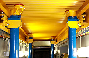 Prefabricated workshop pit showing jacking system and pit safety cover in closed postition from underneath