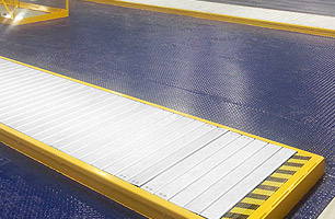 Prefabricated drop-in pit showing pit safety cover in closed postition from ground level